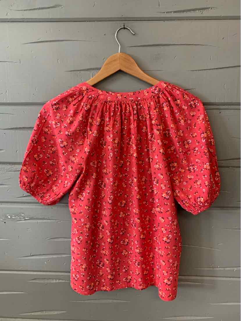 Pink floral puff-sleeve blouse with gathered neckline, lightweight fabric, small size.