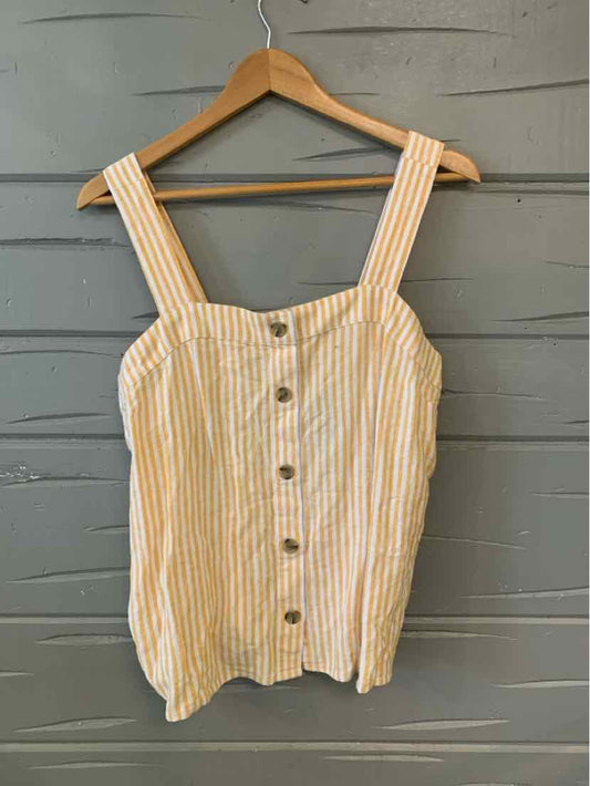 Yellow and white striped sleeveless button-down top with wide straps on wooden hanger.