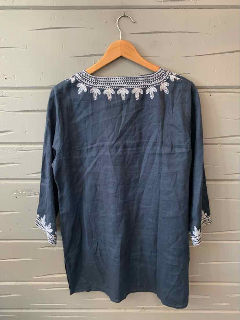 Navy blue long-sleeve tunic with white floral embroidery on collar and sleeve cuffs.