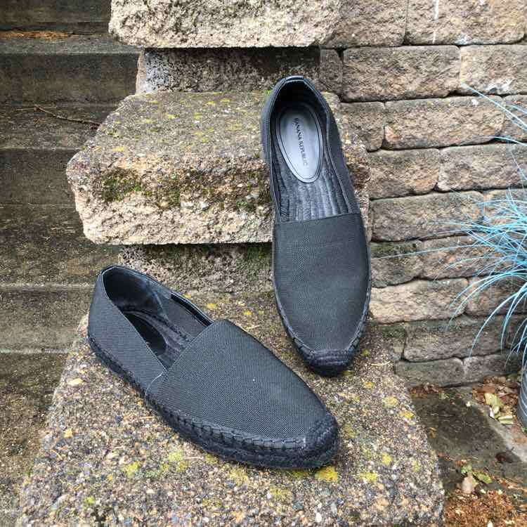 Black slip-on espadrille flats with braided jute sole and rounded toe, size 7.5.