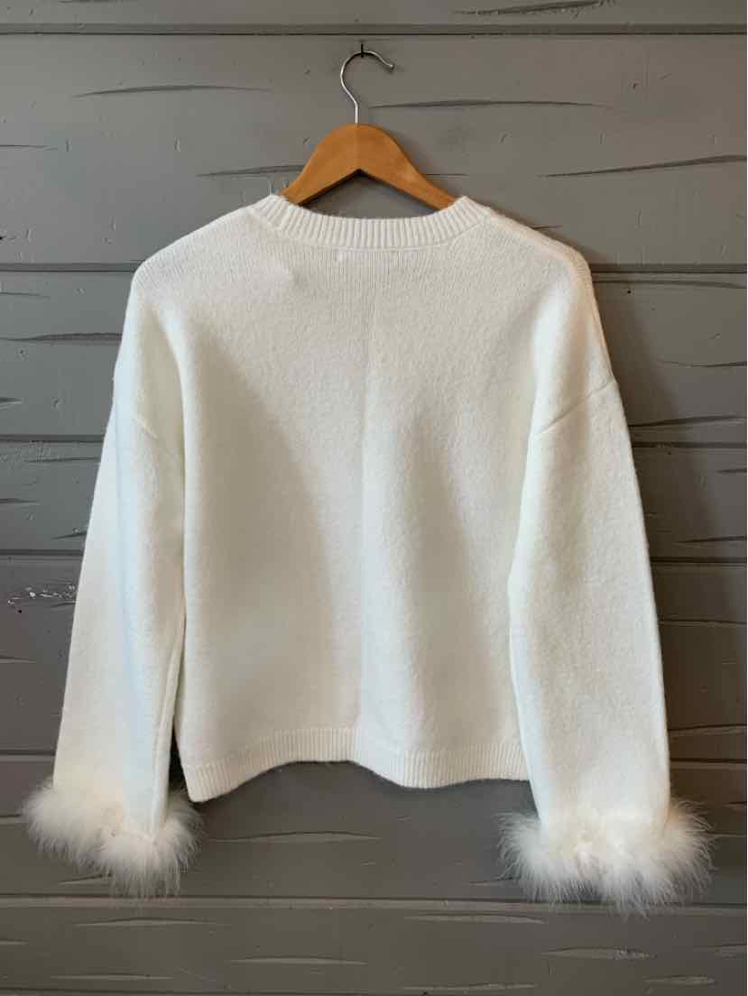 White long-sleeve sweater with a high neckline and fluffy feather cuffs on sleeves.