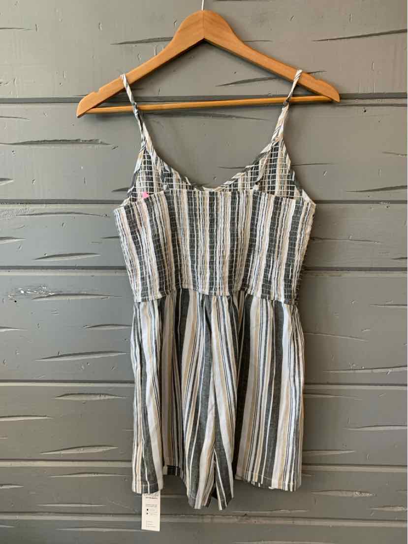 Gray and white striped sleeveless romper with adjustable spaghetti straps on wooden hanger.