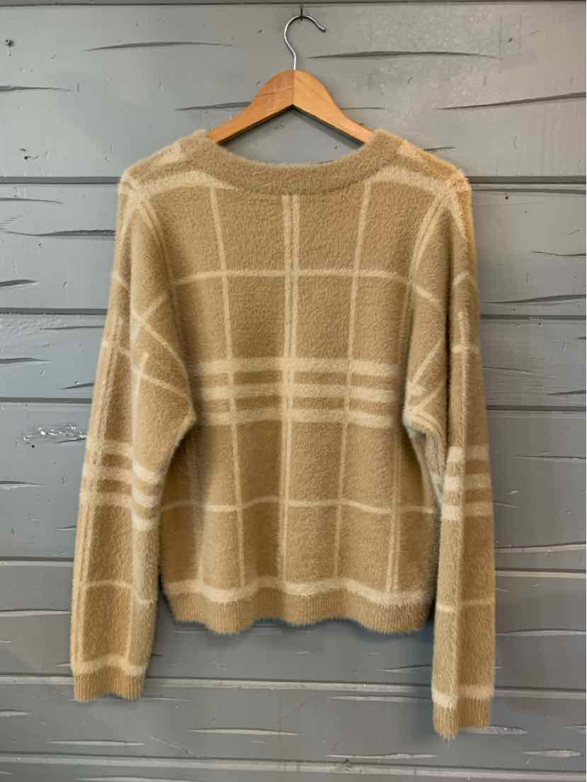 Tan plaid knit sweater with crew neck and long sleeves, size XL, hanging on wooden hanger.