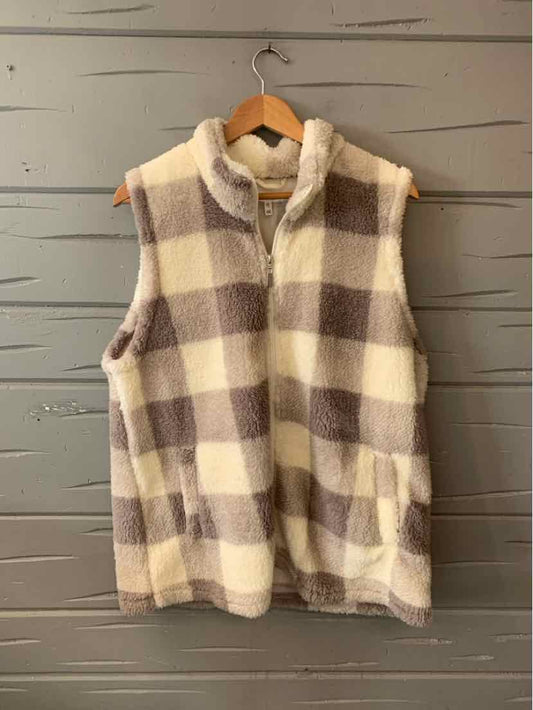 Sleeveless plush vest with gray and white gingham pattern and front zip closure.