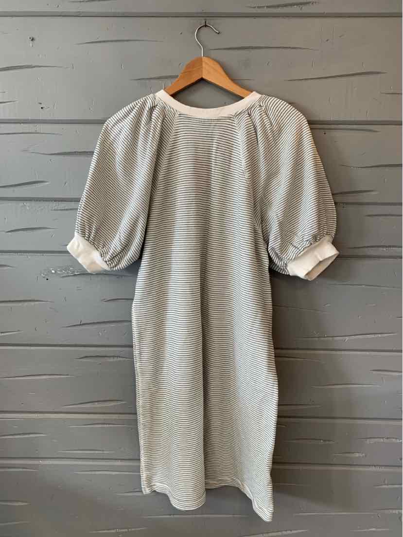 Light gray knee-length dress with subtle horizontal stripes, puffed short sleeves, and a round neckline.
