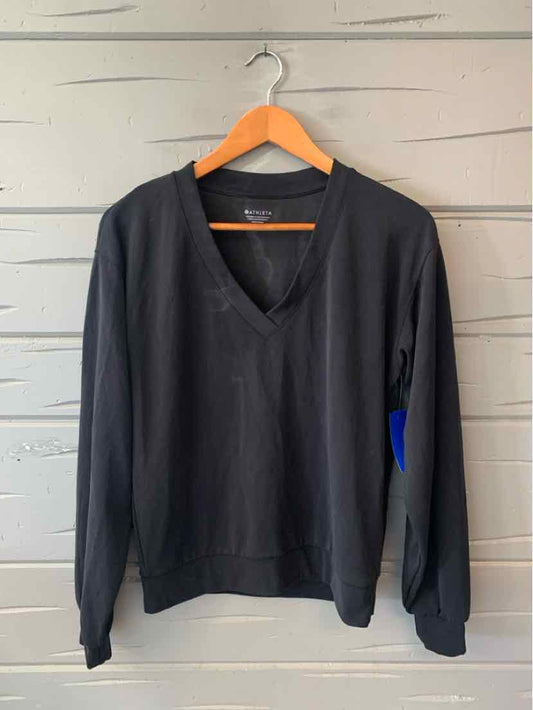 Black long-sleeve V-neck casual top for women's activewear apparel.