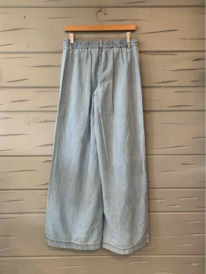 Light blue-gray wide-leg pants with an elastic waistband and soft, textured fabric.