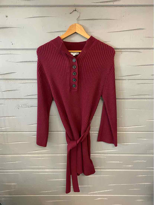 Burgundy long-sleeve knit sweater dress with ribbed collar and buttoned placket, waist tie belt.