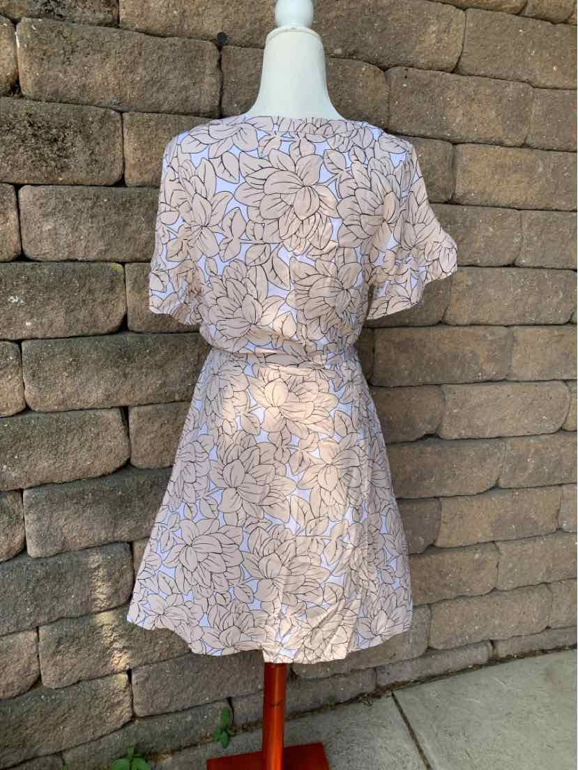Tan short-sleeve dress with blue floral print and cinched waist, knee-length hem.