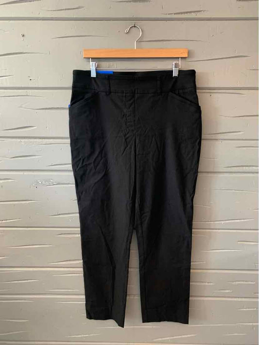Black tailored women's pants with a mid-rise waist and straight-leg cut, size large.
