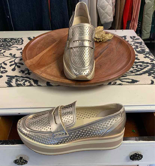 Metallic gold platform loafer with perforated upper and penny strap detailing, size 9.