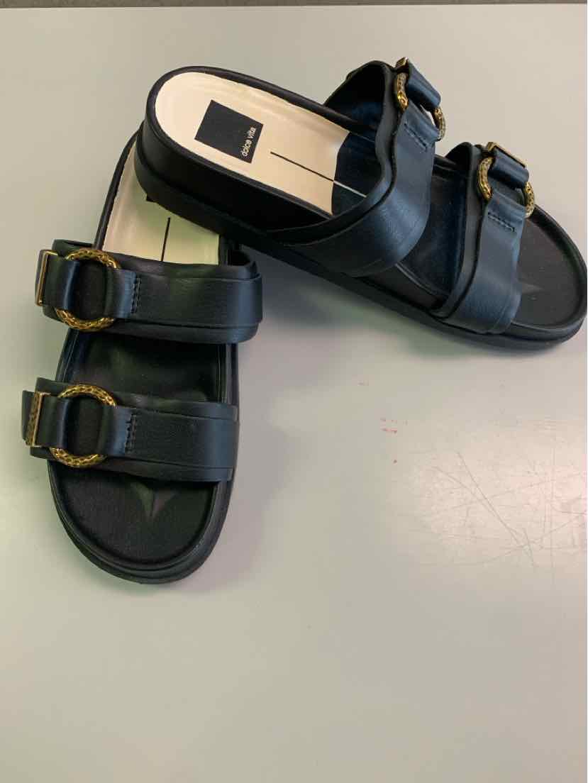 Black double-strap sandals with gold-tone buckles and a cushioned sole, size 8.