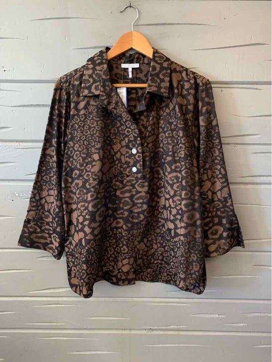 Beige and dark brown patterned blouse with a collared neckline, button front, and three-quarter sleeves.