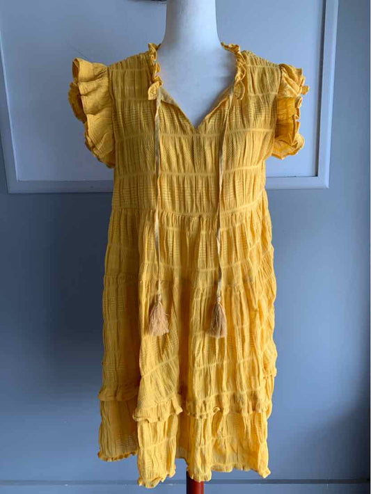 Yellow short-sleeve midi dress with ruffled sleeves and textured fabric detailing.