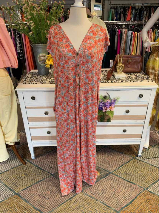 Pink floral maxi dress with short sleeves and V-neck on a mannequin.