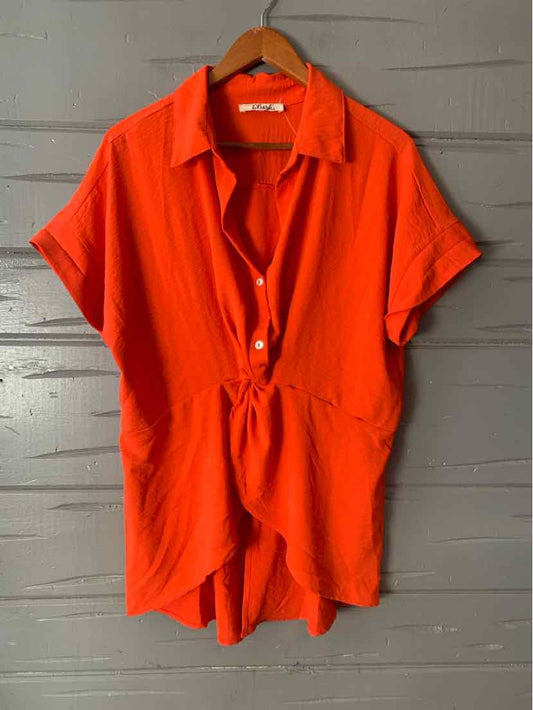 Red short-sleeve romper with collar, button front, and cinched waist in size 1X.