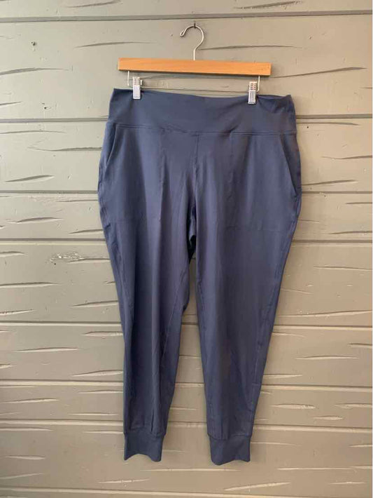 Dark blue high-waisted stretch pants with a tapered leg and side pockets, size 2X.