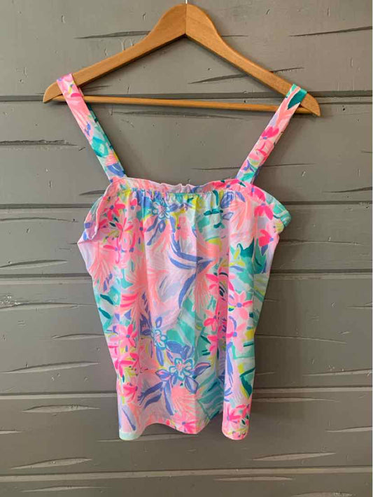 Sleeveless pink top with colorful tropical floral print and square neckline on wooden hanger.