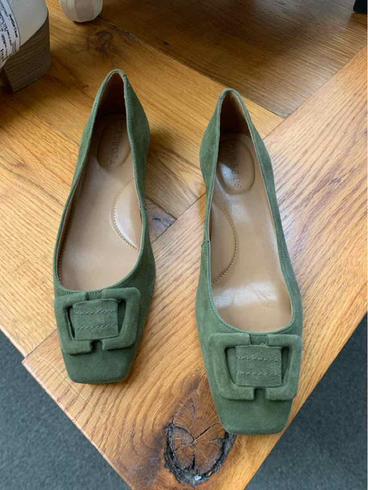 Green suede ballet flats with square toes and matching buckle detail, size 7.