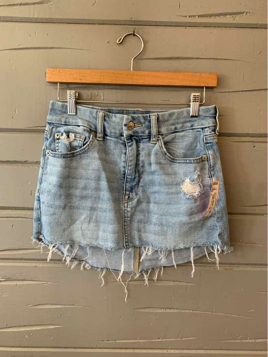 Light blue distressed denim mini skirt with frayed hem and front pockets, size 6.