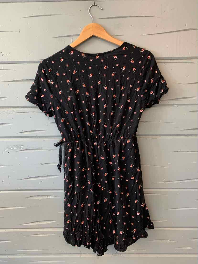 Black floral short-sleeve dress with cinched waist and ruffle hem, size large.