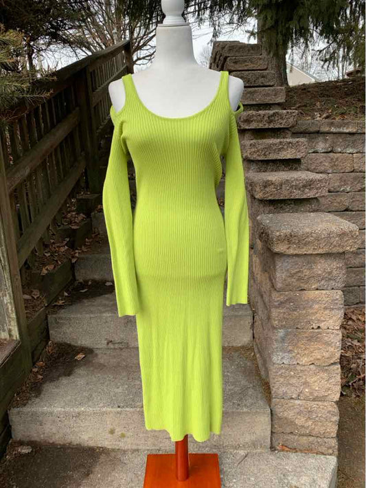Lime green knit midi dress with scoop neckline and cold shoulder cutouts.