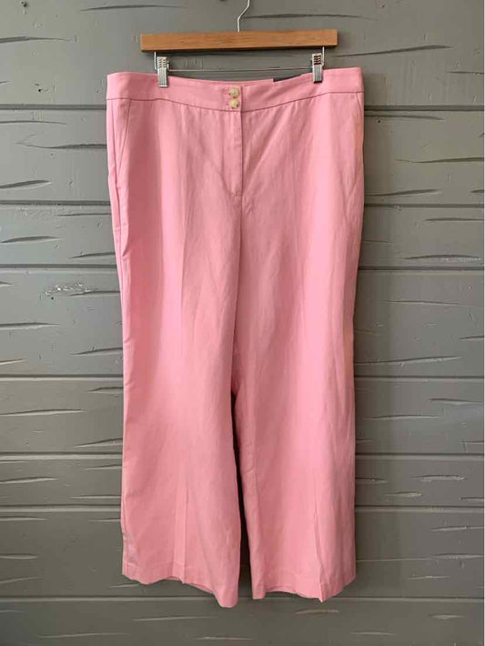 Light pink wide-leg pants with front button and zipper closure, side pockets, and belt loops.