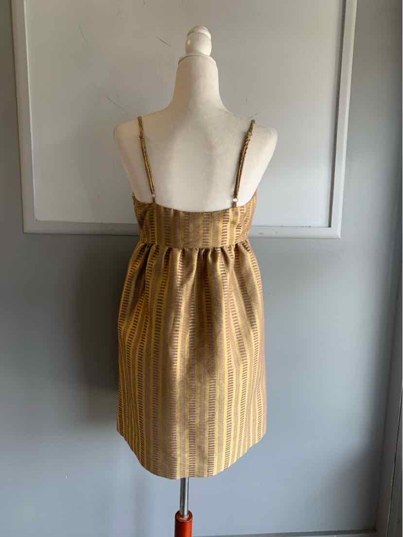 Gold and tan striped jacquard mini dress with thin straps and gathered waist.