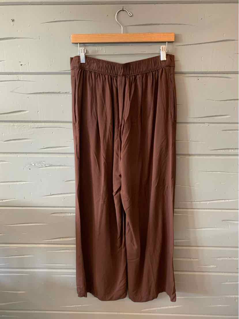 Brown wide-leg pants with elastic waistband, soft lightweight fabric, size medium.
