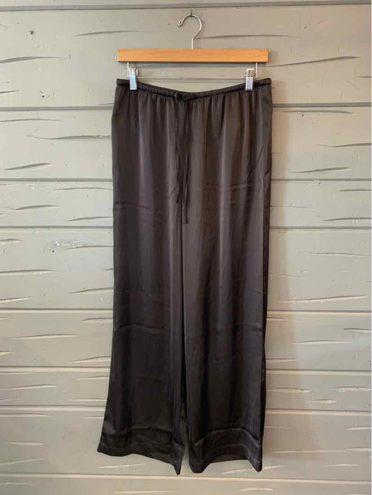 Black wide-leg satin pants with elastic waistband and drawstring detail.