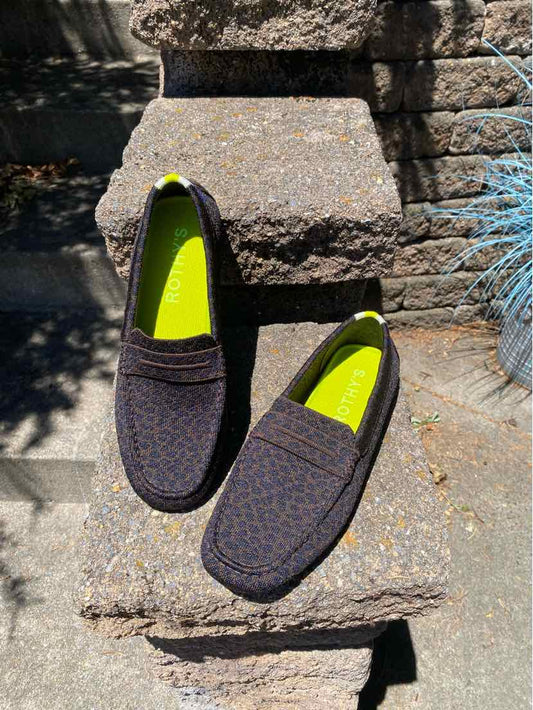 Pair of slip-on shoes with a cheetah print fabric upper and bright yellow insoles, size 10.5.