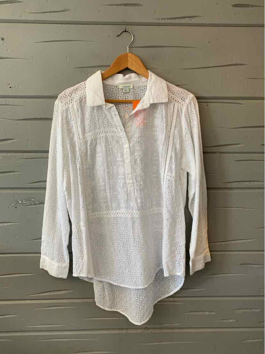 White long-sleeve blouse with collar and button-down front, lightweight textured fabric, loose fit, high-low hem.