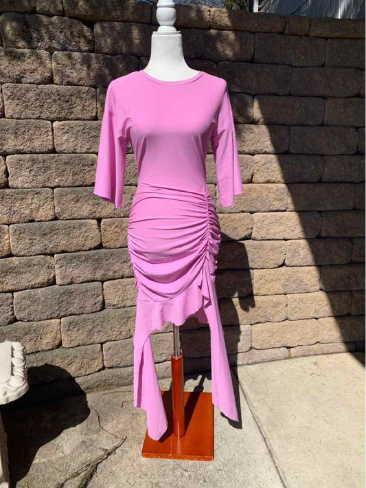 Light purple midi dress with ruched detailing and asymmetrical hem on mannequin.