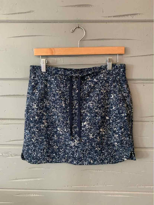 Navy blue floral patterned skirt with adjustable drawstring waist in size 6.