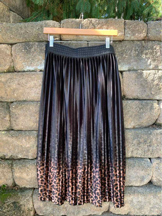 Black pleated maxi skirt with a leopard-print hem and wide elastic waistband.