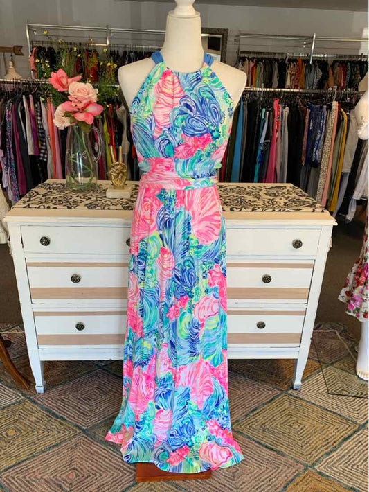 Sleeveless halter neck maxi dress with vibrant pink, blue, and green floral print.