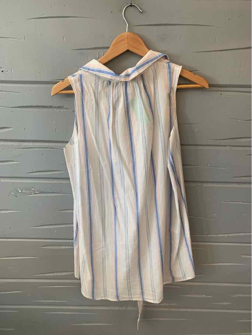 Sleeveless white blouse with blue vertical stripes and a tied collar hanging on wooden hanger.