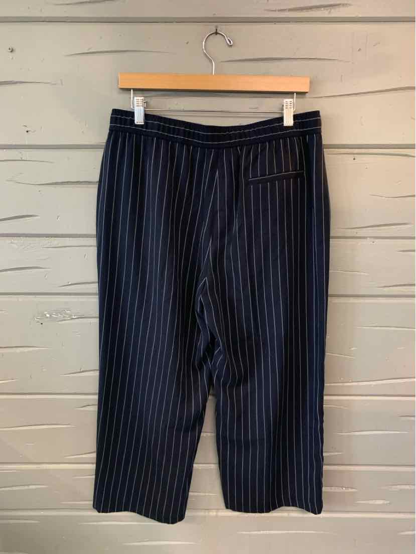 Navy blue wide-leg pants with thin white vertical pinstripes and an elastic waistband.