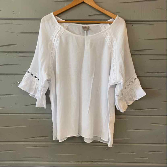White blouse with scoop neckline and 3/4 sleeves featuring ruffle and lace trim detail.