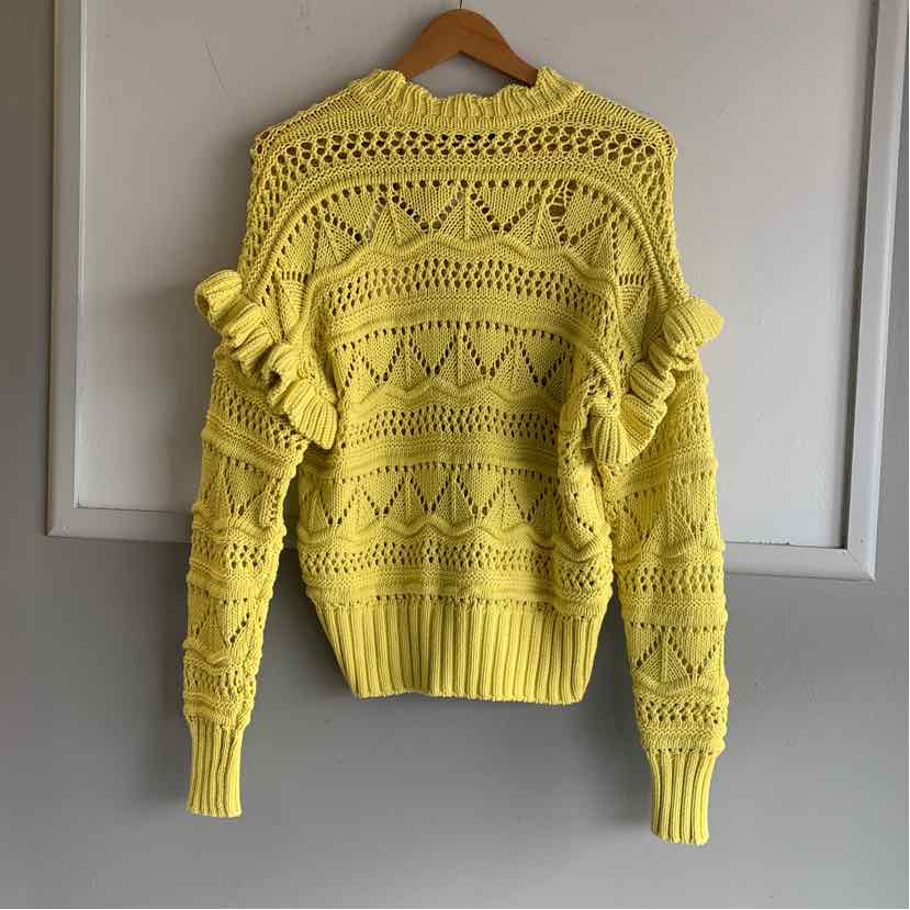 Yellow knit sweater with openwork diamond patterns and ruffled shoulder details.