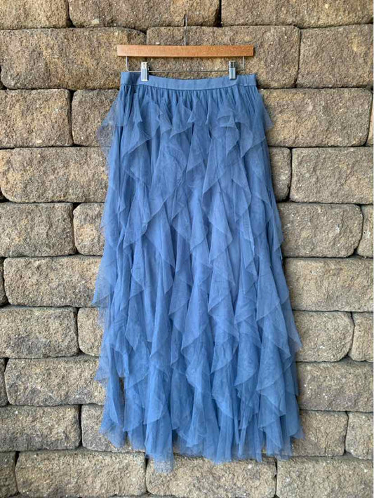 Blue tiered tulle midi skirt with elastic waistband and layered ruffle design.