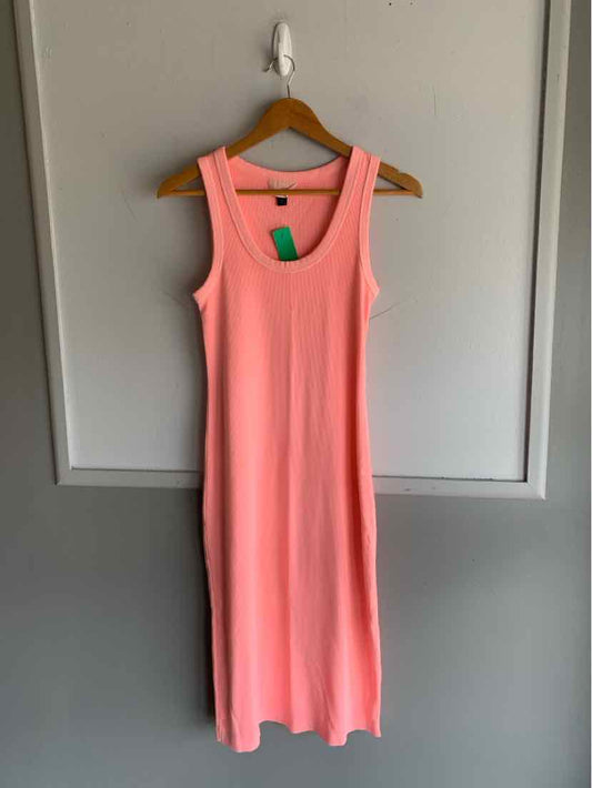 Sleeveless midi dress in solid bright pink with scoop neckline and relaxed fit.