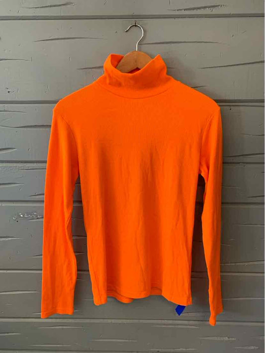 Orange long-sleeve turtleneck casual top in women's activewear apparel style.