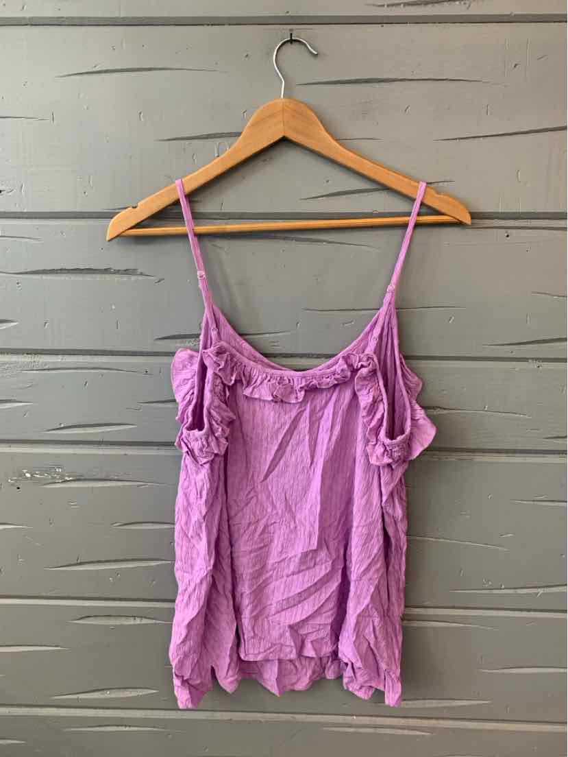 Lavender lace-trimmed camisole top with thin adjustable straps on a wooden hanger.