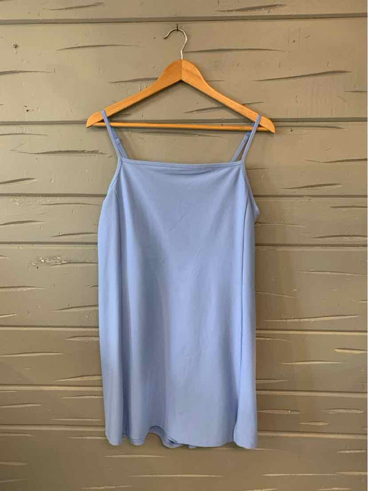 Light blue sleeveless dress with thin spaghetti straps and a straight neckline, hanging on wooden hanger.