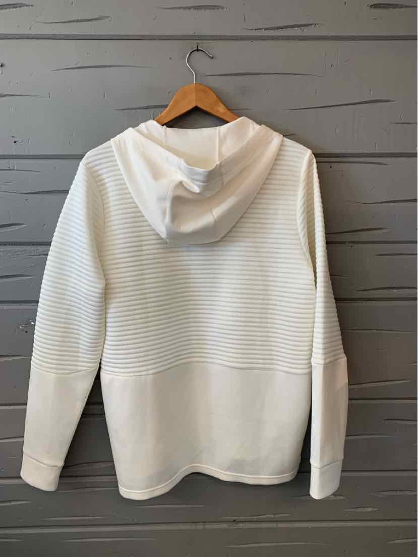 Cream-colored knit hoodie with a draped hood, ribbed horizontal texture, and long sleeves.