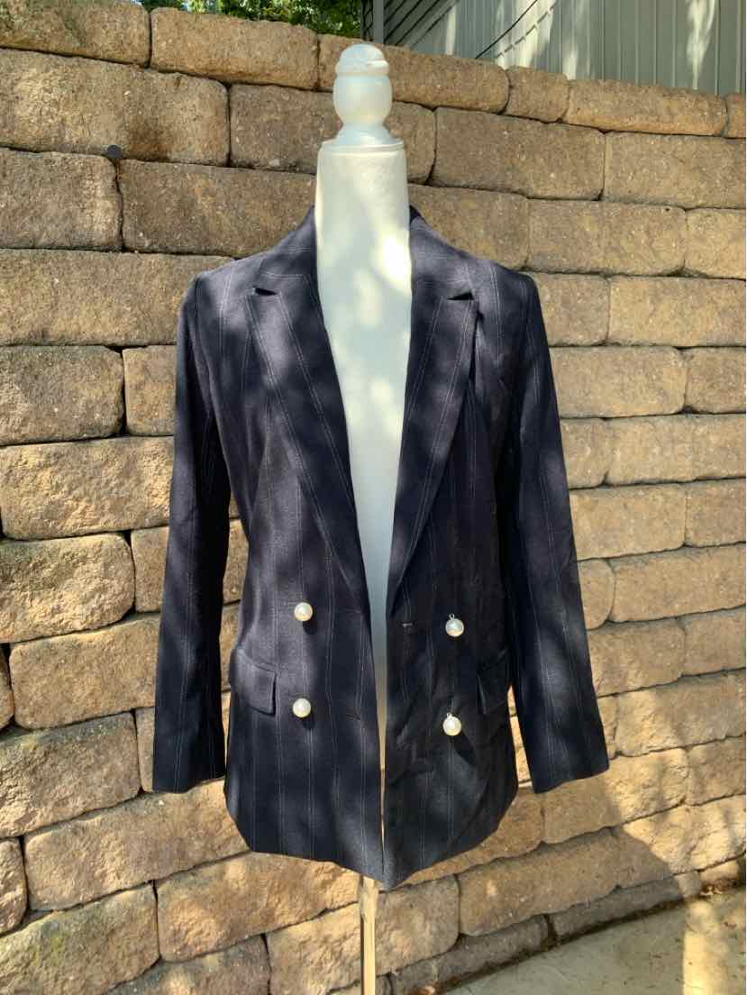 Navy blue double-breasted blazer with gold buttons, structured shoulders, and notched lapels.