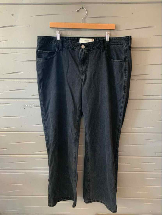 Black denim jeans in size 16 with a classic five-pocket style and straight leg cut.