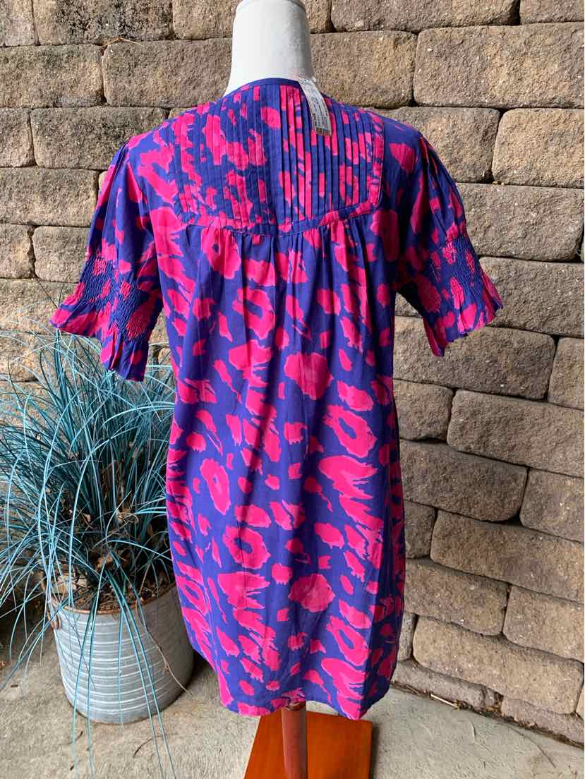 Short-sleeve dress in bright pink and purple abstract floral print, lightweight fabric, gathered back yoke, size XS.