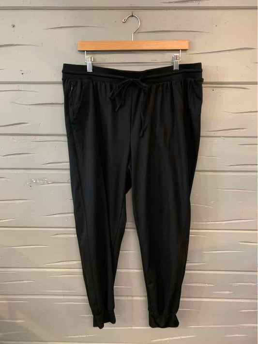 Black drawstring waist jogger pants with tapered legs and elastic cuffs in size XL.